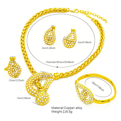 Gold-plated four-piece jewelry set with teardrop rhinestone necklace, bracelet, earrings, and ring on red velvet stands. - Image 12