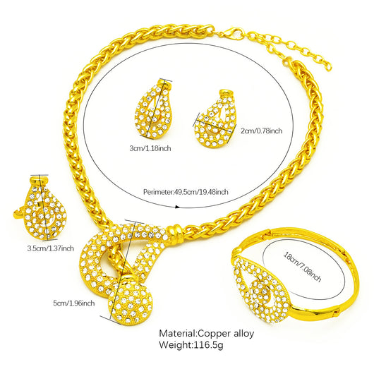 Gold-plated four-piece jewelry set with teardrop rhinestone necklace, bracelet, earrings, and ring on red velvet stands. - Image 12