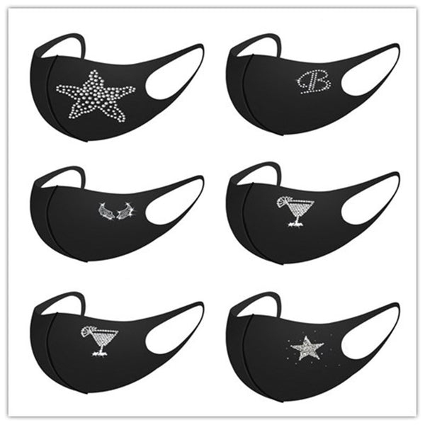 Black face mask with a white rhinestone 'Queen' text and crown design, featuring ear loops.