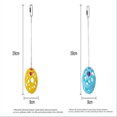 Orange hollow rubber ball bird toy with a pink bell inside, hanging from a silver chain and carabiner clip. - Image 10