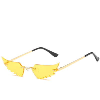Purple wing-shaped rimless sunglasses with gold-colored metal arms and black ear tips on a white background. - Image 12