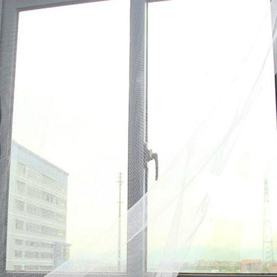 White self-adhesive mosquito screen applied to a gray window frame, offering clear visibility to the outside. - Image 7