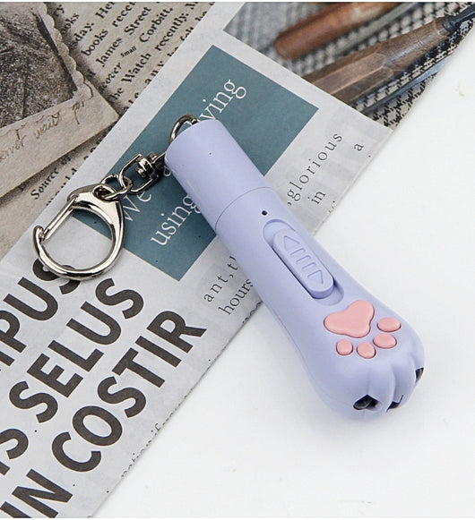 Light purple paw-shaped cat laser pointer toy with USB charging, featuring multiple red laser patterns, soft white light, and UV light. - Image 10