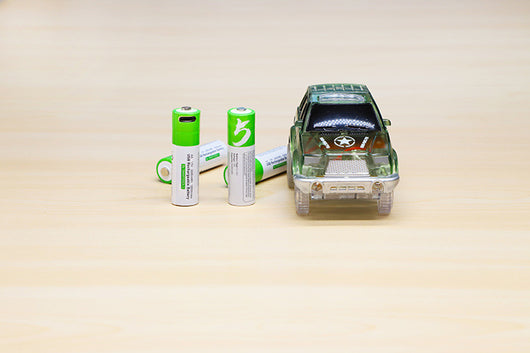 Two green AA 1.5V rechargeable batteries with Type-C ports and a white USB-C charging cable in green retail packaging. - Image 17
