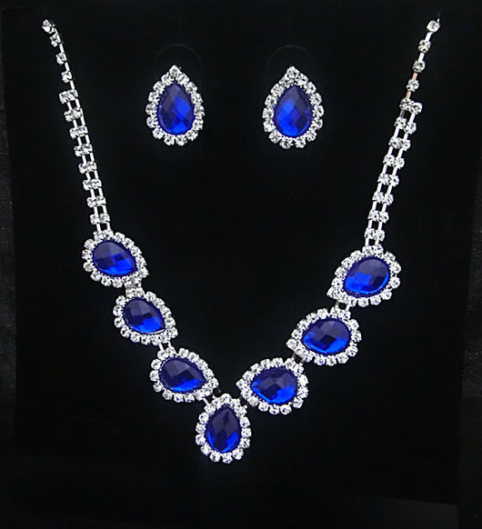 Purple teardrop rhinestone necklace and matching stud earrings set on a black background. - Image 7