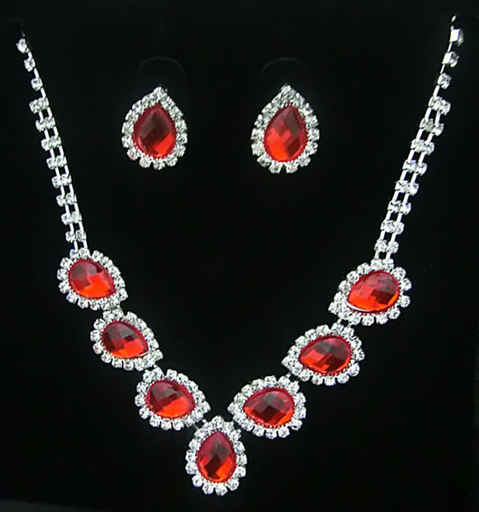 Purple teardrop rhinestone necklace and matching stud earrings set on a black background. - Image 6