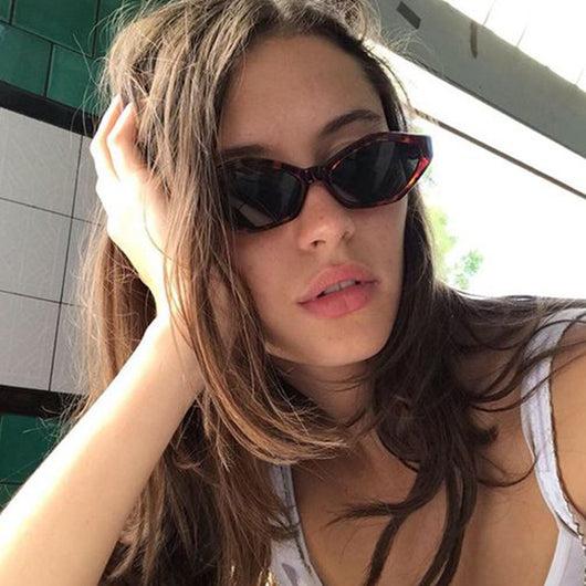 Angular cat-eye sunglasses with a tortoiseshell frame, brown gradient lenses, and gold jumping cheetah temple details. - Image 3