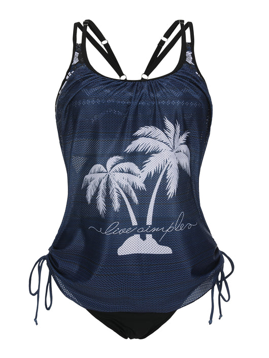 Olive green tankini top with white palm trees and 'live simple' text, paired with black swim bottoms on a beach. - Image 17