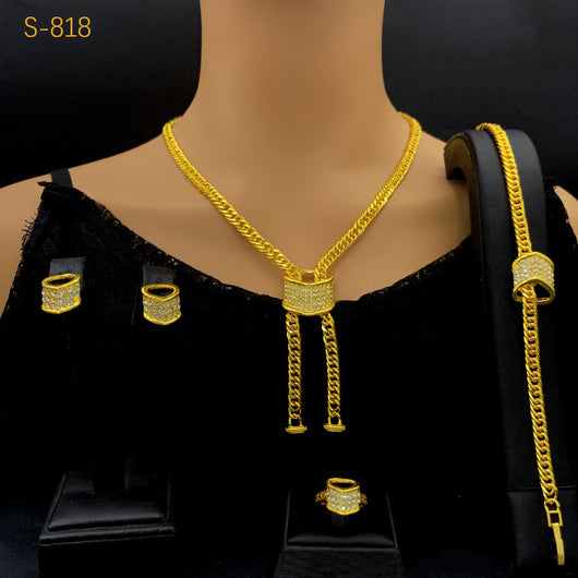 Gold-plated four-piece jewelry set with teardrop rhinestone necklace, bracelet, earrings, and ring on red velvet stands. - Image 14
