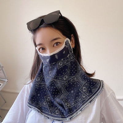 Female cream and black floral polka dot sun protection mask with ear loops, designed for eye corner protection. - Image 43