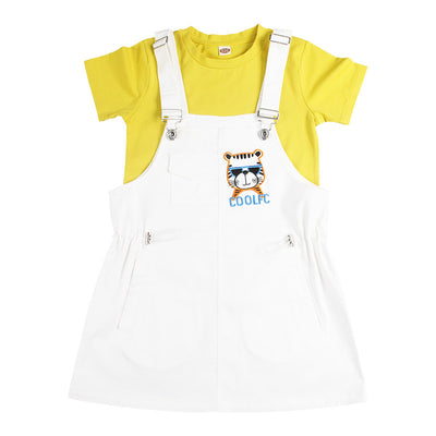 Family of three in matching yellow t-shirts and white outfits by a pool. Father and son wear shorts, mother and daughter wear overall dresses. - Image 7
