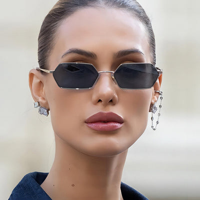 Women's polygonal sunglasses with gold frames and brown lenses, featuring a unique hexagonal shape.