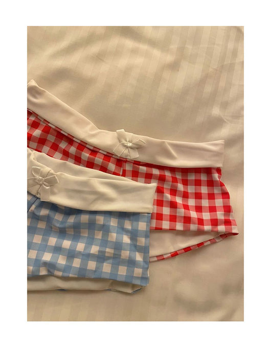 Light blue and white gingham bikini set with a triangle halter top and low-rise boy short bottoms with a small bow. - Image 18
