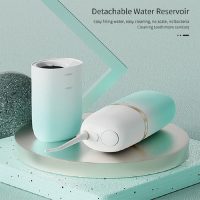 White and rose gold portable electric water flosser with a curved nozzle and volume markings for 160ml and 200ml. - Image 6