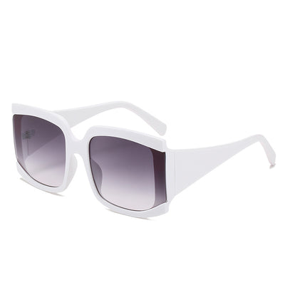 Oversized square-frame sunglasses with a light pink frame and gradient lenses transitioning from purple to orange to yellow. - Image 8