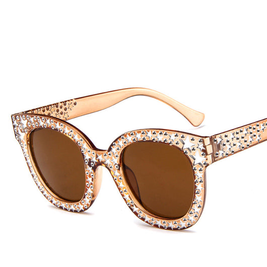 Black cat-eye sunglasses for ladies, featuring silver star embellishments on the frames and temples. - Image 3