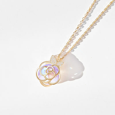 Gold-tone necklace with an iridescent camellia flower pendant and small clear stones on a delicate chain. - Image 7
