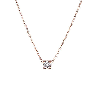 Delicate silver-colored chain necklace with a single square-cut clear stone pendant in a four-prong setting on a woman's neck. - Image 5