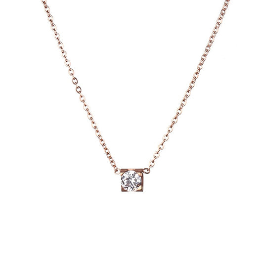 Delicate silver-colored chain necklace with a single square-cut clear stone pendant in a four-prong setting on a woman's neck. - Image 5