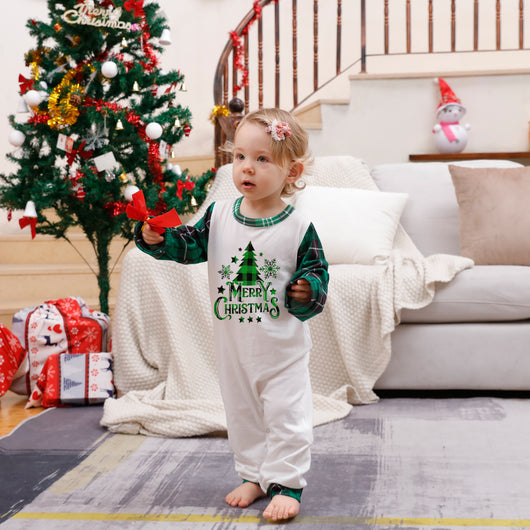 Family of four wearing matching green plaid Christmas pajamas with "Merry Christmas" and Christmas tree print. - Image 15