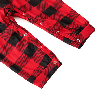 Baby in a red and black buffalo plaid long-sleeve pajama romper, viewed from the back with arms raised. - Image 13