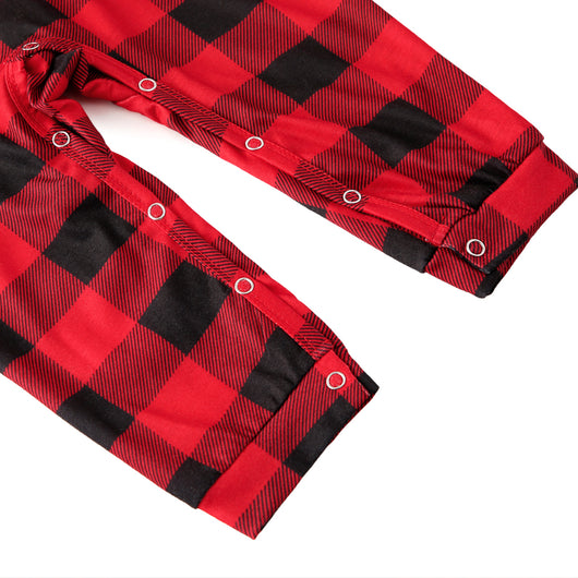 Baby in a red and black buffalo plaid long-sleeve pajama romper, viewed from the back with arms raised. - Image 13