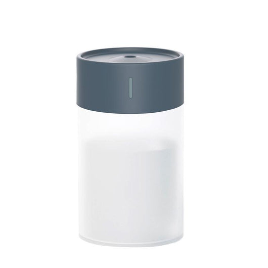 Cylindrical humidifier with a frosted white body and a light pink top, featuring a small mist outlet. - Image 9