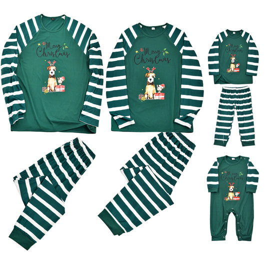 Woman in a Christmas pajama set with a white top, green sleeves, dinosaur graphic, and green fair isle pants. - Image 4
