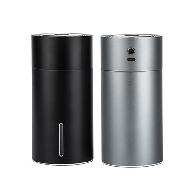 Black cylindrical vehicular humidifier with a silver trim and a vertical indicator light on a white background. - Image 6