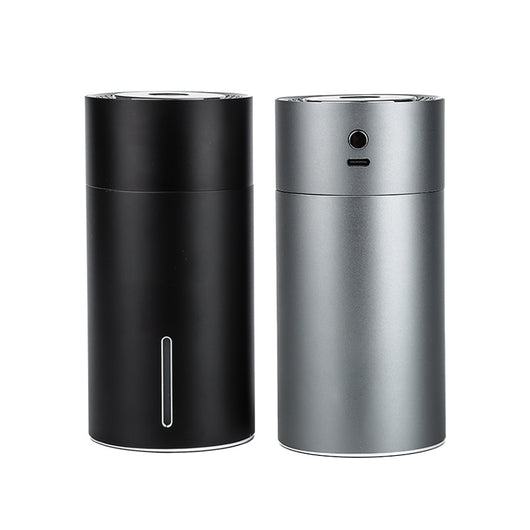 Black cylindrical vehicular humidifier with a silver trim and a vertical indicator light on a white background. - Image 6