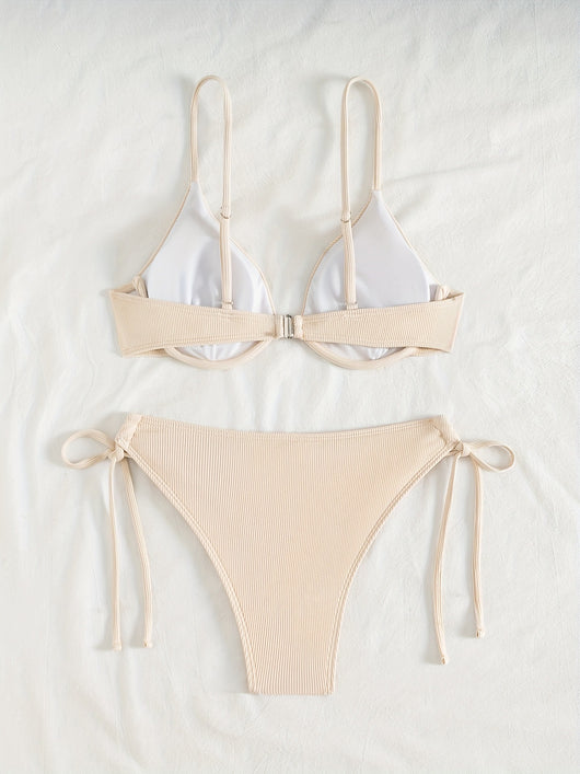 Black ribbed two-piece bikini with an underwire top and tie-side bottoms on a white marble surface. - Image 36