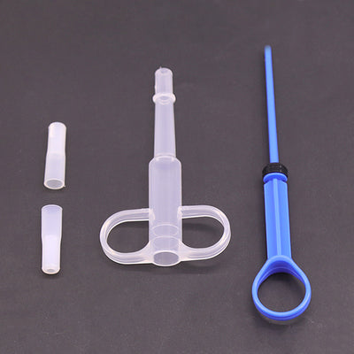 Pet feeding kit with a green syringe-style feeder and two clear teats, packaged for dogs and cats. - Image 9