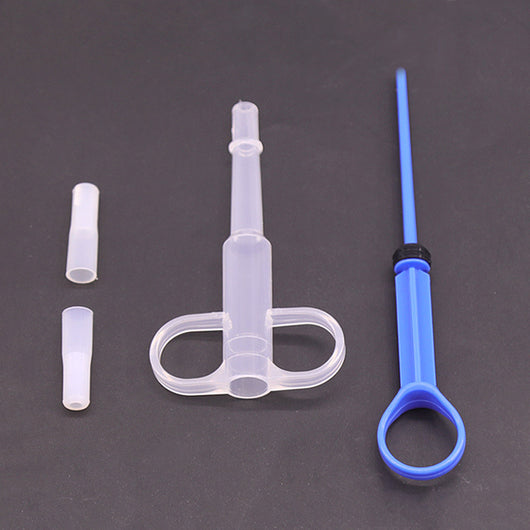 Pet feeding kit with a green syringe-style feeder and two clear teats, packaged for dogs and cats. - Image 9