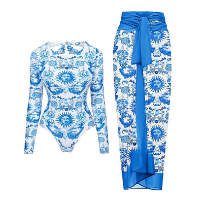 White one-piece swimsuit with a blue sun and intricate floral pattern, featuring a scoop neck and wide straps. - Image 14