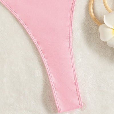 Light pink one-piece swimsuit with thin spaghetti straps and a high-cut leg design, worn by a woman. - Image 8