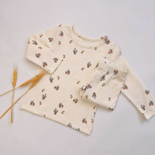 Light yellow infant long-sleeved pajama set with milk bottle and cookie print, suitable for homewear. - Image 3