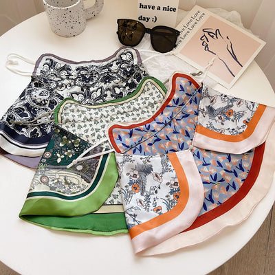 Female cream and black floral polka dot sun protection mask with ear loops, designed for eye corner protection. - Image 26