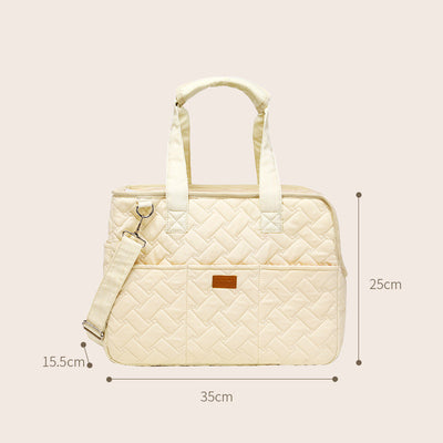 Cream quilted portable pet carrier with top handles, detachable shoulder strap, front pocket, and ventilation mesh. - Image 3