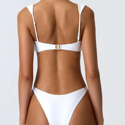 Women's white seamless bikini swimsuit with wide shoulder straps and gold ring details on top and high-cut bottom. - Image 2