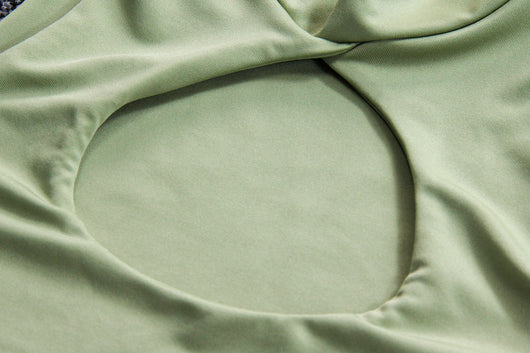 Light green two-piece set featuring a sleeveless crop top with a high neck and chest cutout, paired with a ruched bodycon mini skirt. - Image 16