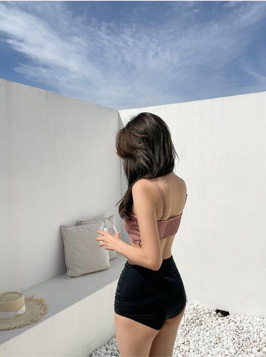 Women's retro high-waisted split bikini with a pink shirred bandeau top and black ruched bottoms. - Image 11