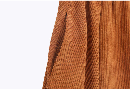 Young girl in a pink and brown color-block corduroy two-piece dress set with a collared top and midi skirt. - Image 12