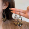 Aretes Retro Chinos de Gotas Huecas - Diseño Elegante