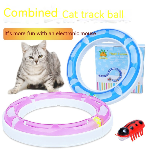 Pink and white circular cat track toy with an orange ball inside a smaller track for pet amusement.