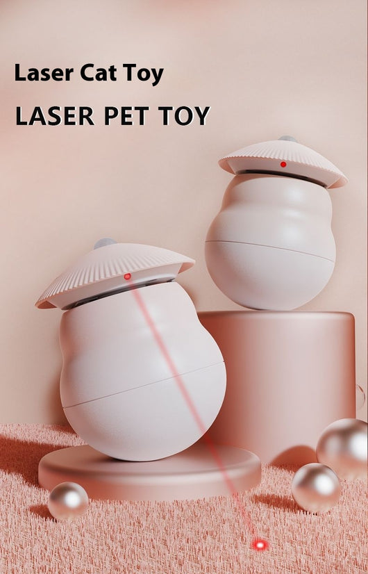 Two pink intelligent electric cat toy tumblers with ribbed tops and red laser emitters, set against a minimalist pink background. - Image 11