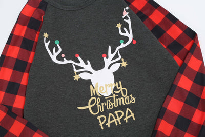 Woman wearing a Christmas pajama set with a dark gray 'Merry Christmas MOMMY' reindeer top and red and black plaid pants. - Image 11