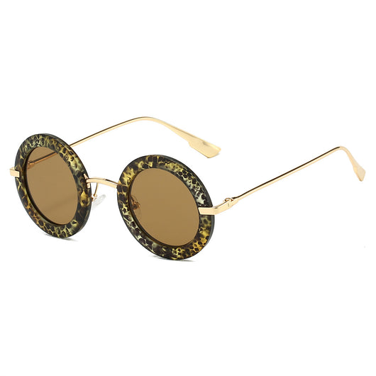 Small frame oval fashion sunglasses with black frames and vibrant orange lenses, held by a hand. - Image 5