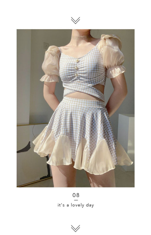 Women's conservative two-piece swimsuit with beige and white houndstooth pattern, sheer puff sleeves, and a flared skirt. - Image 15