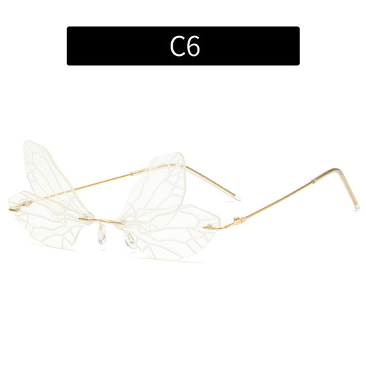 Light green rimless butterfly sunglasses with gold metal frames, featuring a unique veined lens design. - Image 10