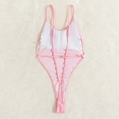 Light pink one-piece swimsuit with thin spaghetti straps and a high-cut leg design, worn by a woman. - Image 9